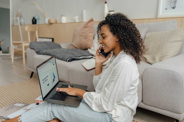 woman in white long sleeve shirt using macbook pro