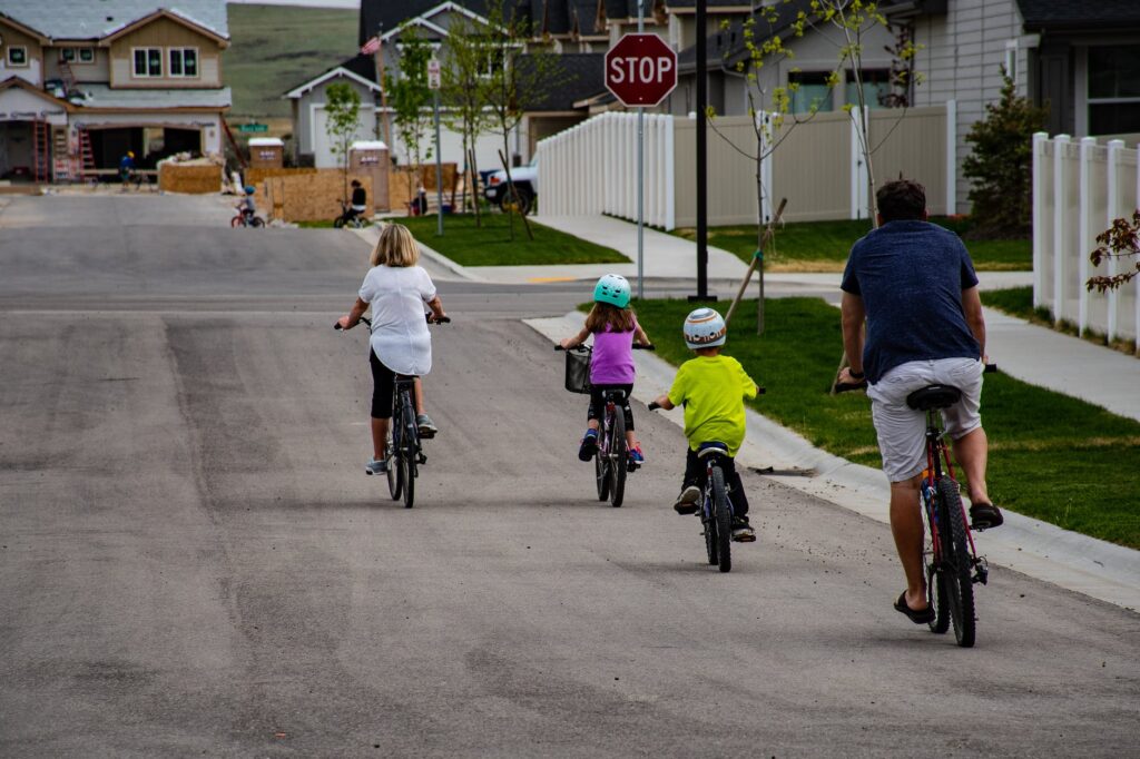 family riding on bicycle