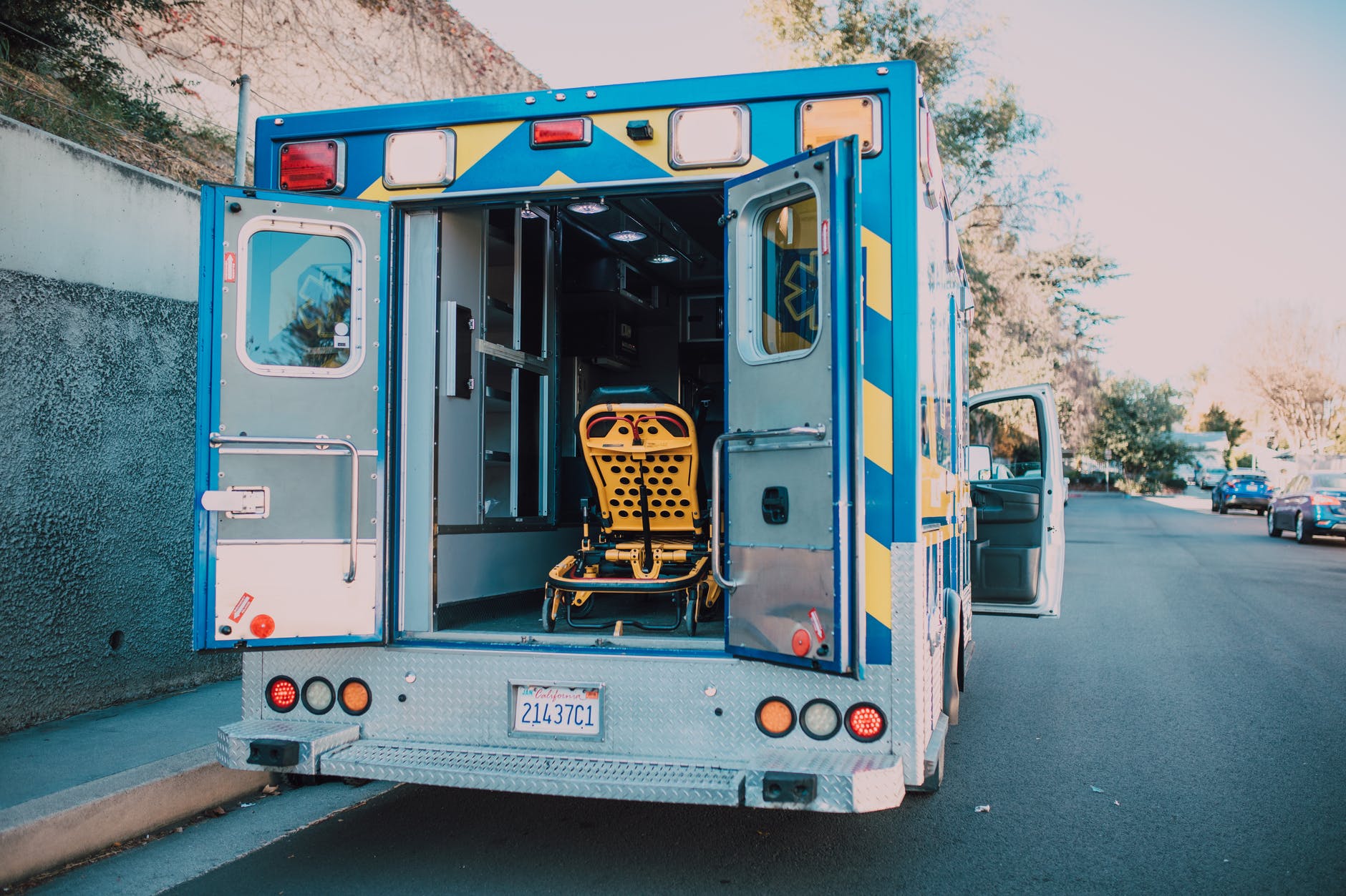 ambulance parked on side of a road